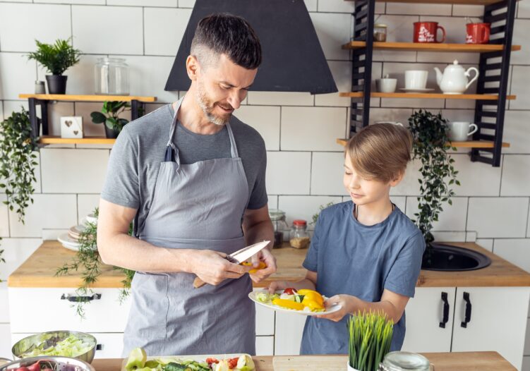 Young person and support worker in kitchen